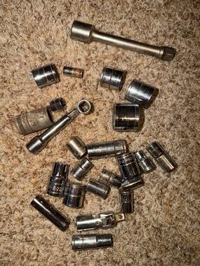 assorted chrome-finished sockets and extensions